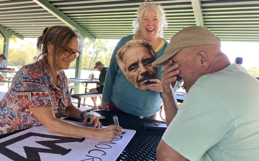 No Kings Sign Making On The River